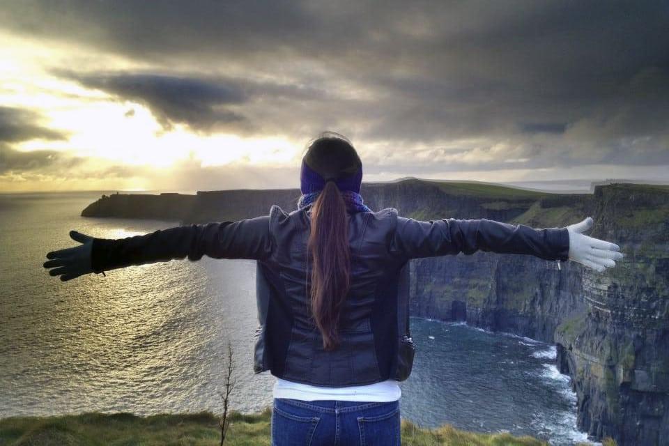 Study abroad student looks out a landscape